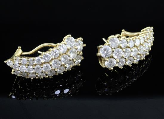 A pair of 14ct gold and diamond encrusted earrings, 27mm.